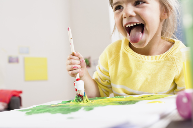 When developing fine motor skills, children may use their left and right hands equally at first. Photo / Getty